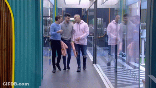 Men Walking Down Hallway Talking GIF