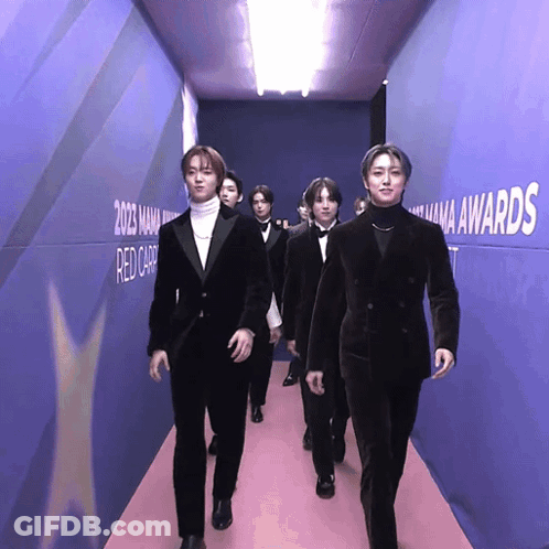 Men Walking Down Hallway With Mana Awards GIF