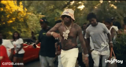 Men Walking Down Street With Hat And Sunglasses GIF