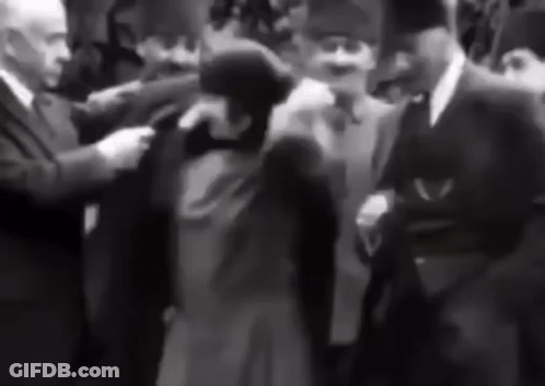 Men Walking In Front Of TRT 1 Screen GIF
