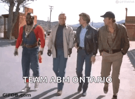Men Walking On Street With Team ABM Ontario GIF