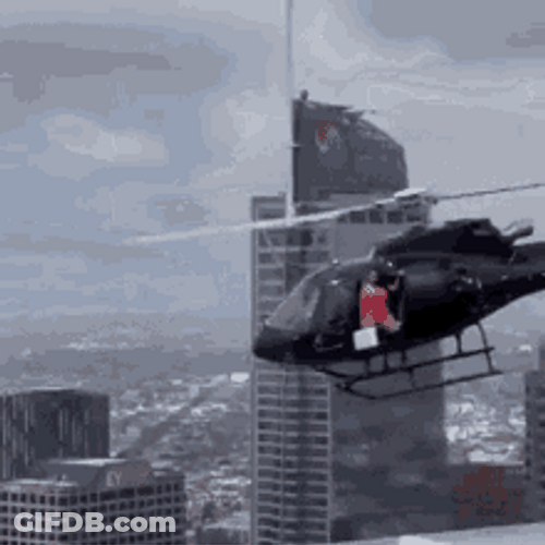 Men Watching Woman Doing Fearless Helicopter Stunt GIF