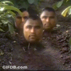 Men With Faces Covered In Dirt And Leaves GIF