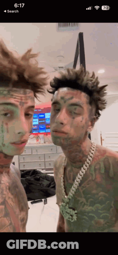 Men With Green Paint On Faces GIF