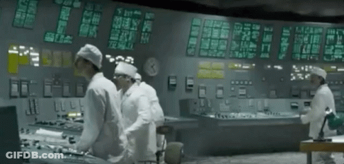 Men Working In Control Room With Clock GIF