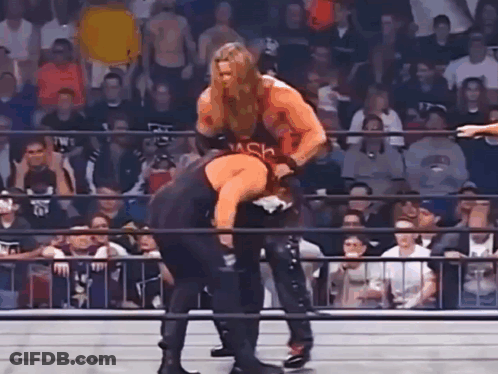 Men Wrestling In Ring In Front Of Crowd GIF