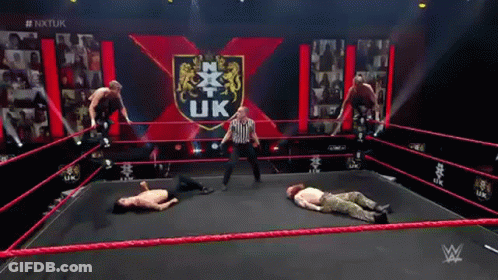 Men Wrestling In Ring With Referee GIF