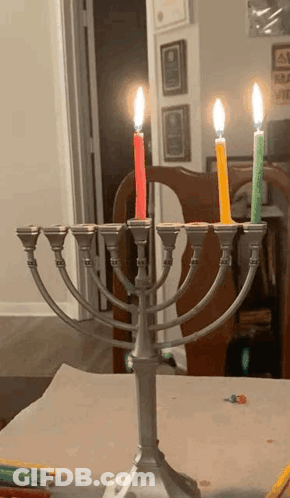 Menorah With Four Lit Candles GIF