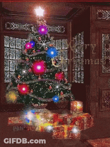 Merry Christmas Greeting With Tree And Gifts GIF