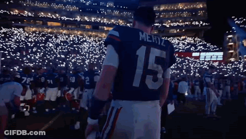 Mertz Football Player Standing Before Crowd GIF