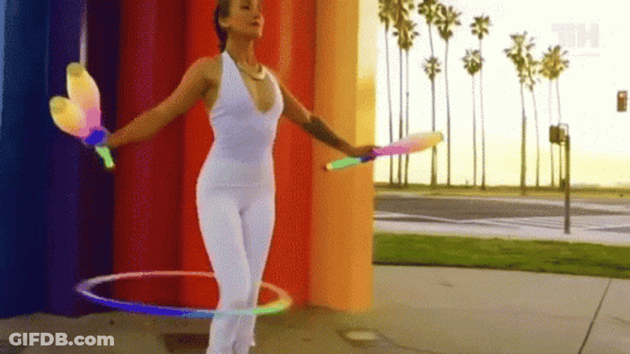 Mesmerizing Circus Juggling Hula Hoop Stunt GIF