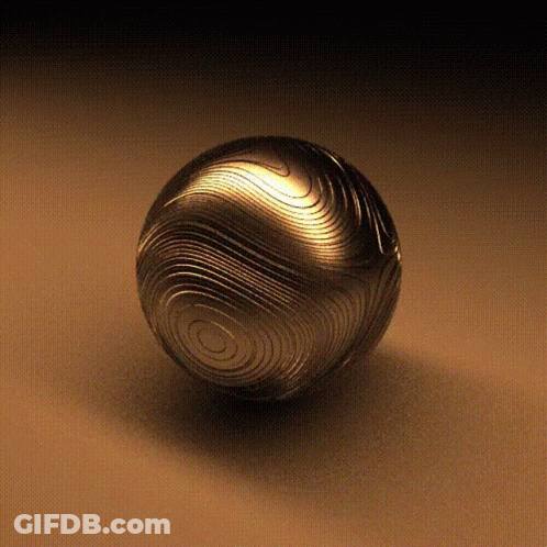 Metal Ball With Pattern On Brown Surface GIF