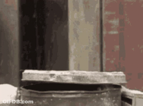 Metal Container With Open Lid On Table GIF