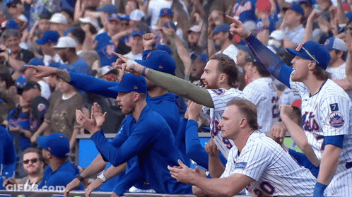 Mets Baseball Players Sitting In Dugout GIF