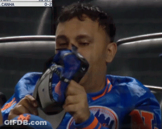 Mets Fan Adjusting Hat Watching Game GIF