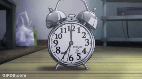 Mezashi Alarm Clock On Wooden Table GIF