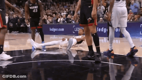 Miami Basketball Player Number 45 Laying On Floor GIF