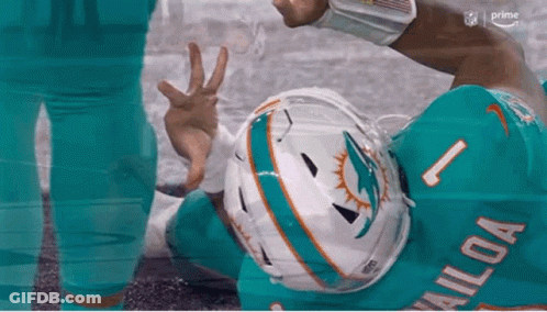 Miami Dolphins Player Giving Peace Sign On Ground GIF