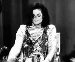 Michael Jackson Sitting In Chair Black And White Eyes Closed GIF