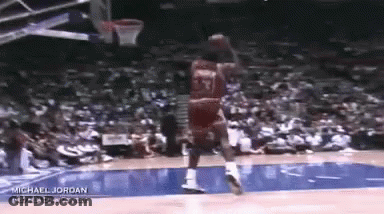 Michael Jordan Is Playing Basketball In Front Of A Crowd . GIF