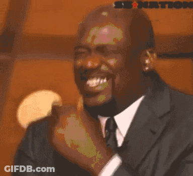 Michael Jordan Is Wearing A Suit And Tie And Is Making A Funny Face . GIF