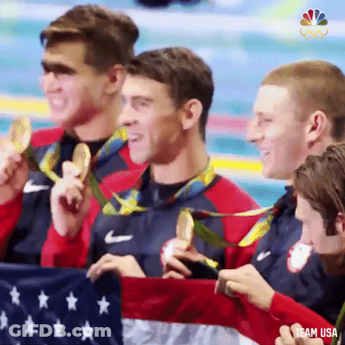 Michael Phelps Picture Taking With Other Medalists GIF