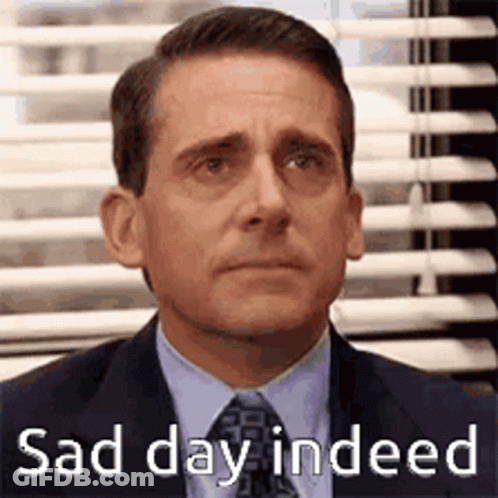 Michael Scott From The Office Is Wearing A Suit And Tie And Looking Sad . GIF