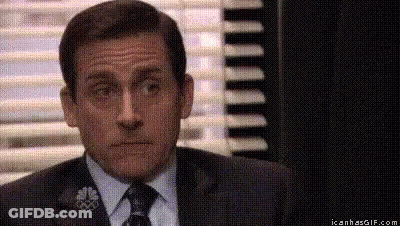 Michael Scott From The Office Is Wearing A Suit And Tie . GIF