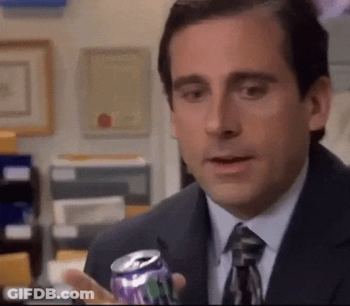 Michael Scott Is Holding A Can Of Soda In His Hand . GIF