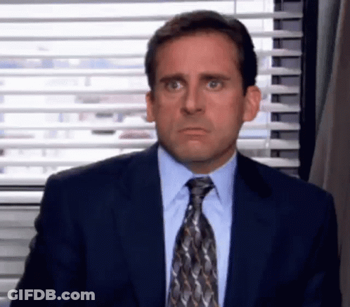Michael Scott Making Funny Face In Suit And Tie GIF