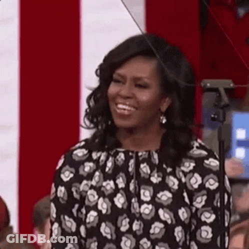 Michelle Obama Smiling Laughing In Front Of Crowd GIF