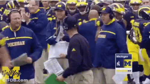 Michigan Football Players And Coaches On Field GIF