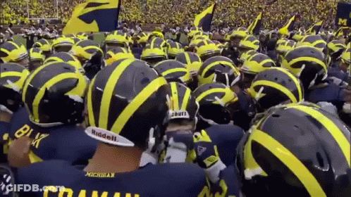 Michigan Football Players In Huddle GIF