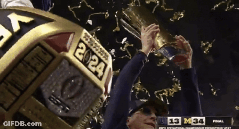 Michigan Wolverines Flexing Trophies GIF