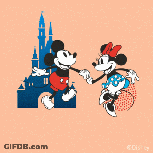 Mickey Mouse And Minnie Mouse Dancing In Front Of A Castle GIF