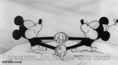 Mickey Mouse And Minnie Mouse Kissing In Snow GIF