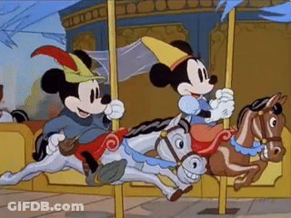 Mickey Mouse And Minnie Mouse Riding A Merry-Go-Round GIF