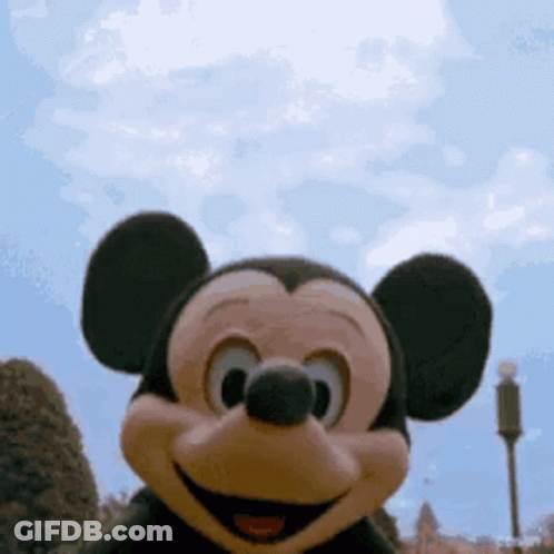 Mickey Mouse Close Up With Blue Sky GIF