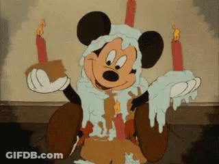 Mickey Mouse Holding Candles And Cake GIF