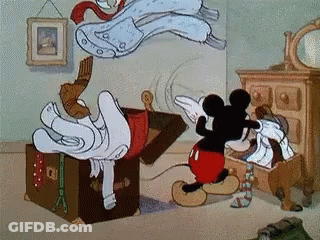 Mickey Mouse Is Opening A Trunk Full Of Clothes GIF