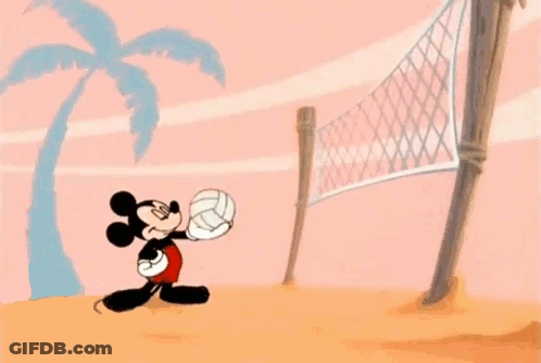 Mickey Mouse Is Playing Volleyball On A Beach . GIF