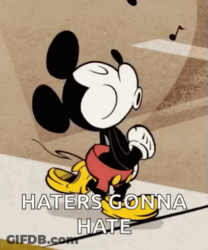 Mickey Mouse Is Walking Down A Sidewalk With The Words `` Haters Gonna Hate '' Written On It . GIF