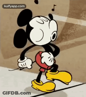 Mickey Mouse Is Walking Down A Street With A Music Note Hanging From His Ears . GIF