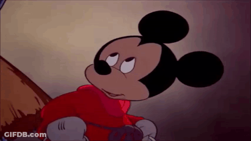 Mickey Mouse Is Wearing A Red Jacket And Gloves And Looking At Something . GIF