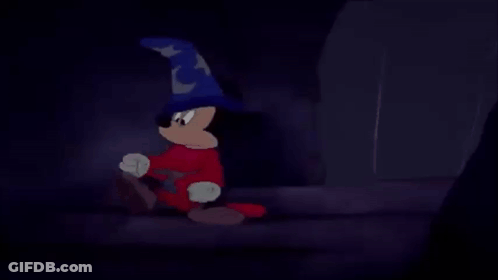 Mickey Mouse Is Wearing A Wizard Hat And Red Pants GIF