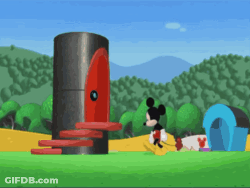 Mickey Mouse Standing By Large Red Cylinder GIF