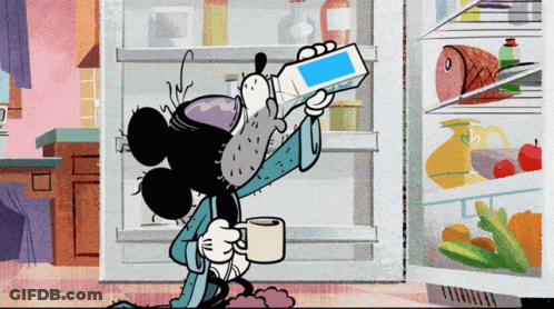 Mickey Mouse Standing In Front Of Refrigerator GIF