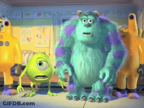 Mike And Sully From Monsters Inc Are Standing Next To Each Other In A Room GIF