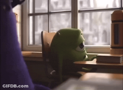 Mike From Monsters Inc Sitting At Desk Looking Out Window GIF