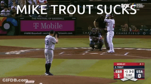 Mike Trout Sucks On A Baseball Field With A T Mobile Ad In The Background GIF
